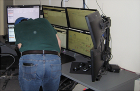 Employee at control desk Employee at control desk